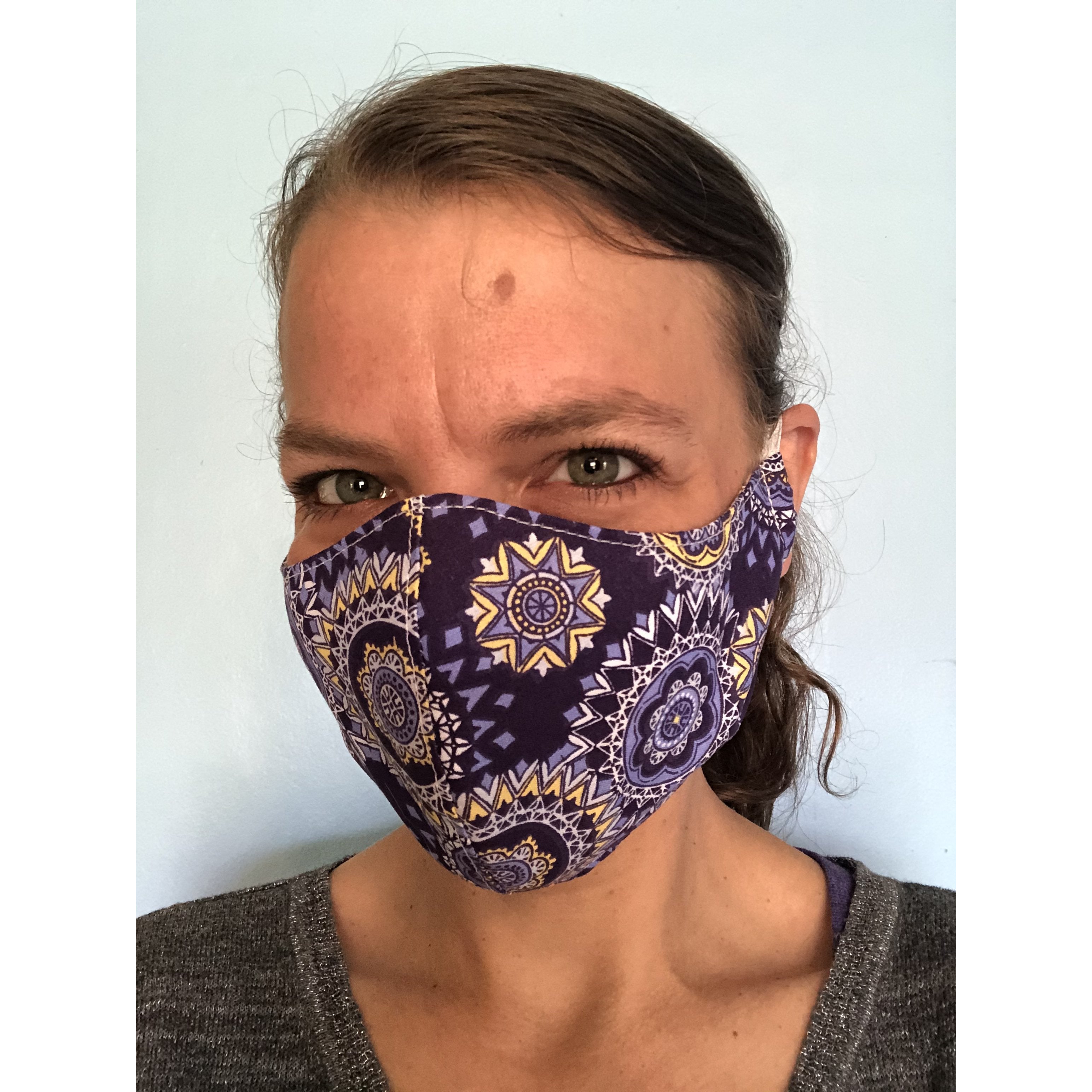 Purple Mandala Face Mask on a face, left view