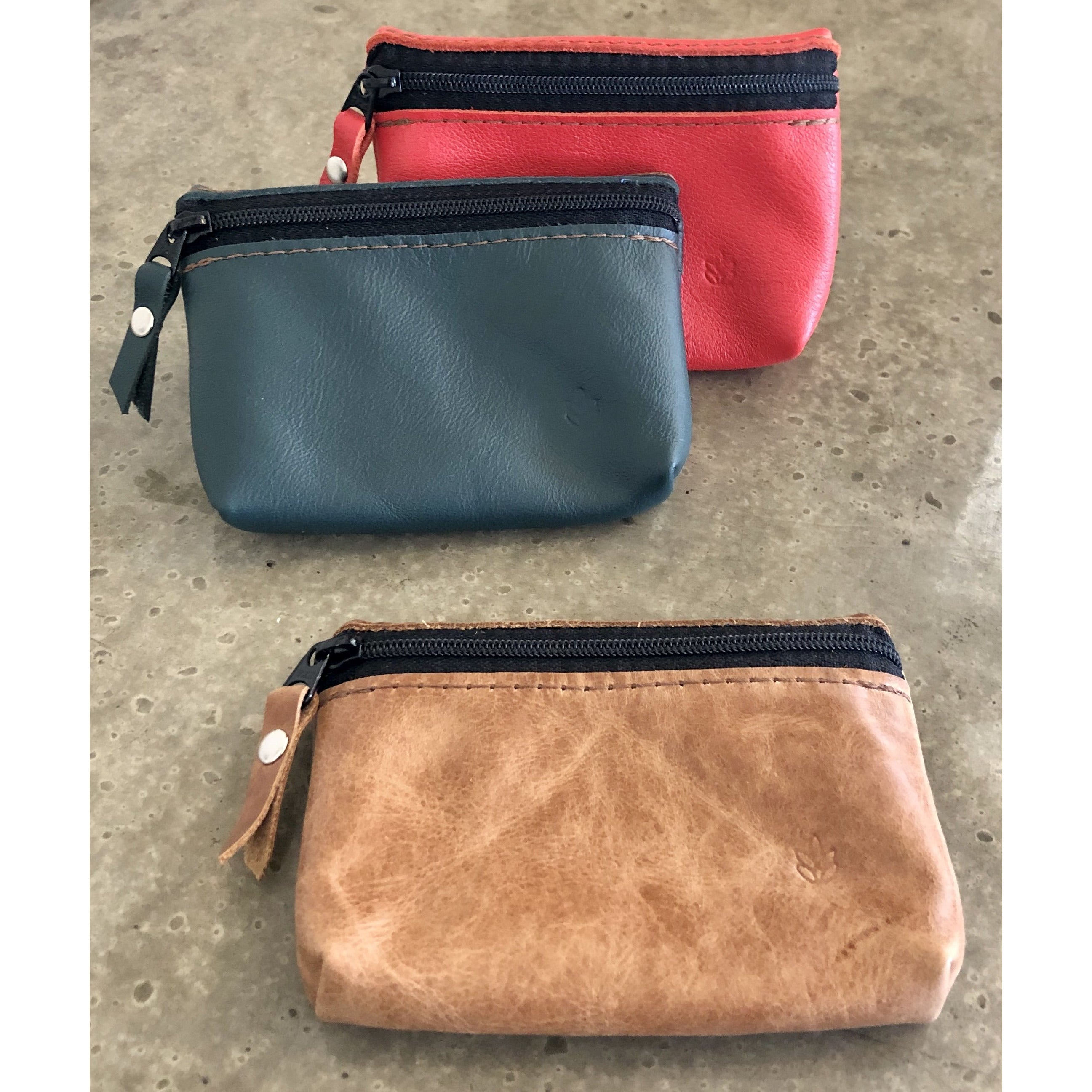 Leather zipper Pouch in beige, teal, and bright orange, with front zipper