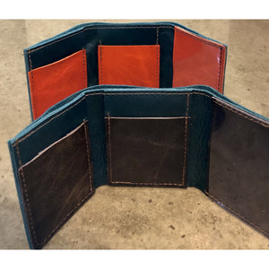 Leather Tri-Fold Wallets in shiny teal, with dark brown or bright orange pockets