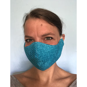 Turquoise Polka Dots Cotton Face Mask, on a face, left view