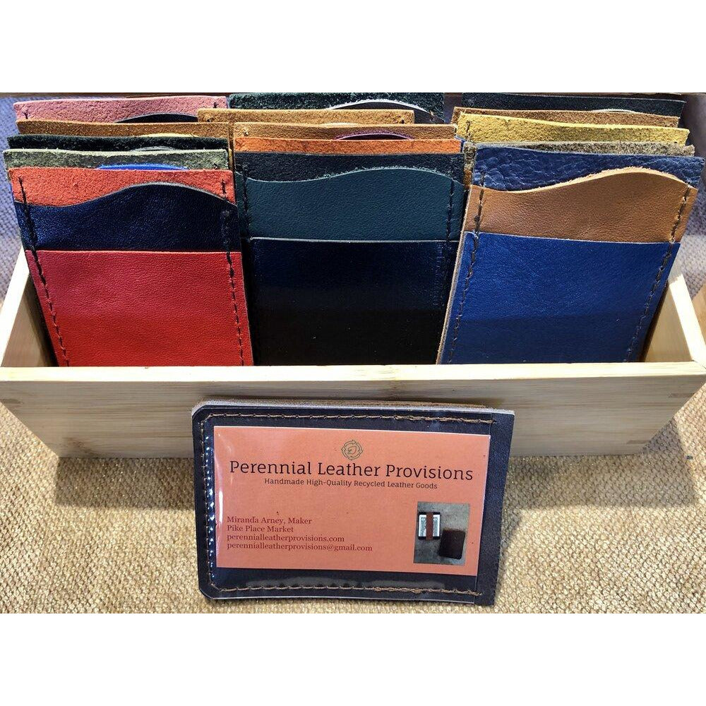 "Just the Essentials" Leather Card Wallet in various colors, taken at the booth at Pike Place Market