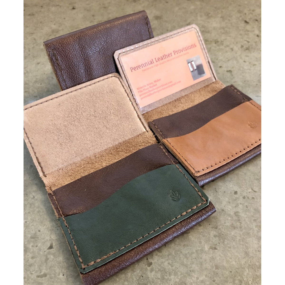 Leather Flip Pouch in Dark Brown, pictured with brown and green pockets, overhead view