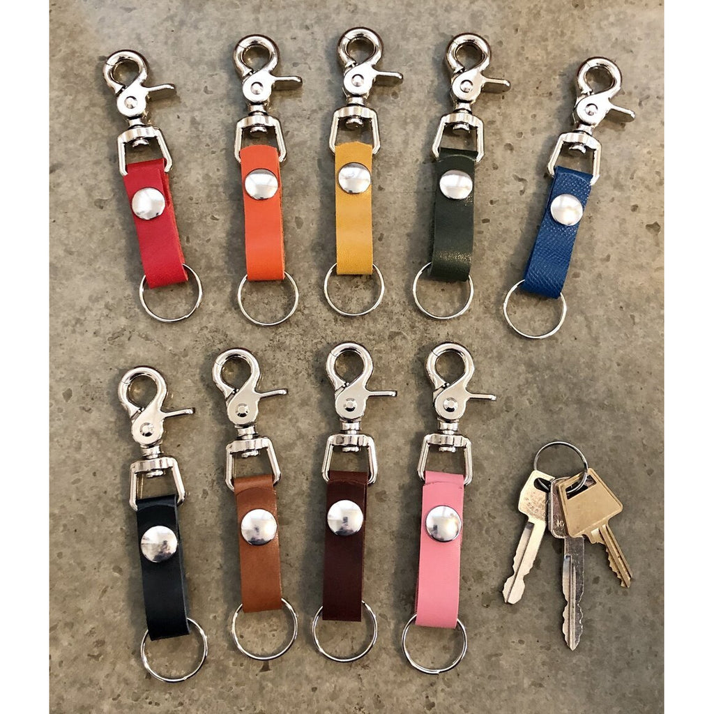 The Perfect Leather Belt Loop Key Chain, in medium length. Current color offerings include: red, orange, yellow, forest green, turquoise, black, light brown, dark brown, and bubblegum pink